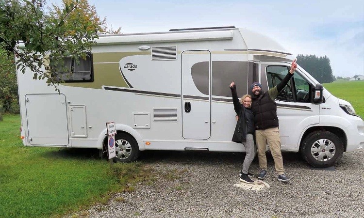 Mark and Nicola Baker in front of their Carado motorhome