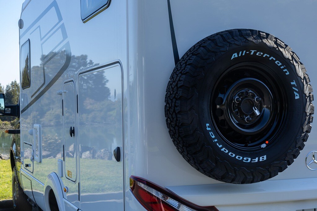 A spare tyre behind a motorhome