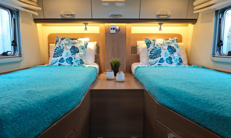 A twin bed setup in a Burstner motorhome