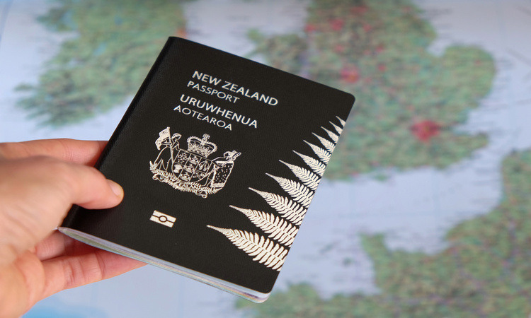 New Zealand passport with map in background