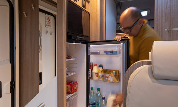 Motorhome fridge open with food inside