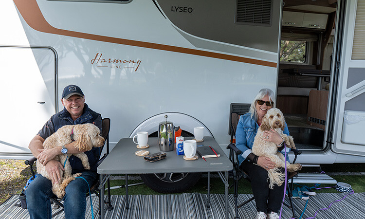 Craig and Sue with dogs outside of their Bürstner Lyseo TD736 