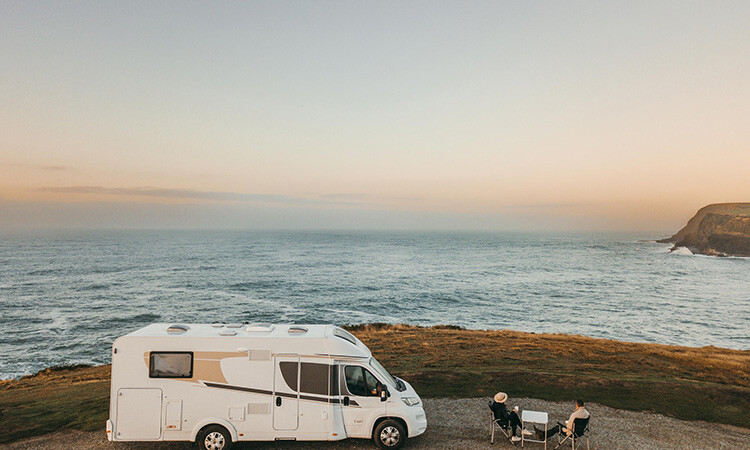 A couple enjoying their time travelling with their motorhome