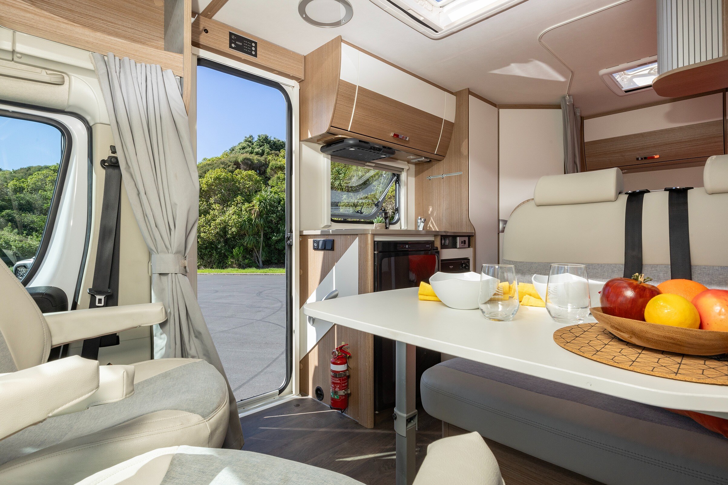 Wilderness 2019 Carado T135 motorhome lounge from front corner