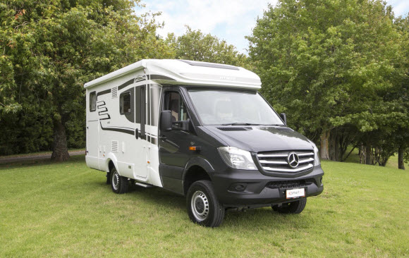 HYMER ML-T 580 4x4 parked on a grassy hill